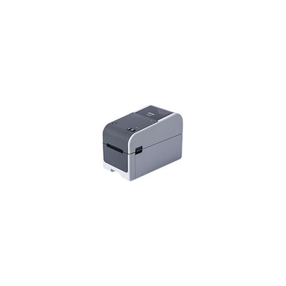 Detalle de la impresora de etiquetas Brother TD-2320D con su zona de trabajo